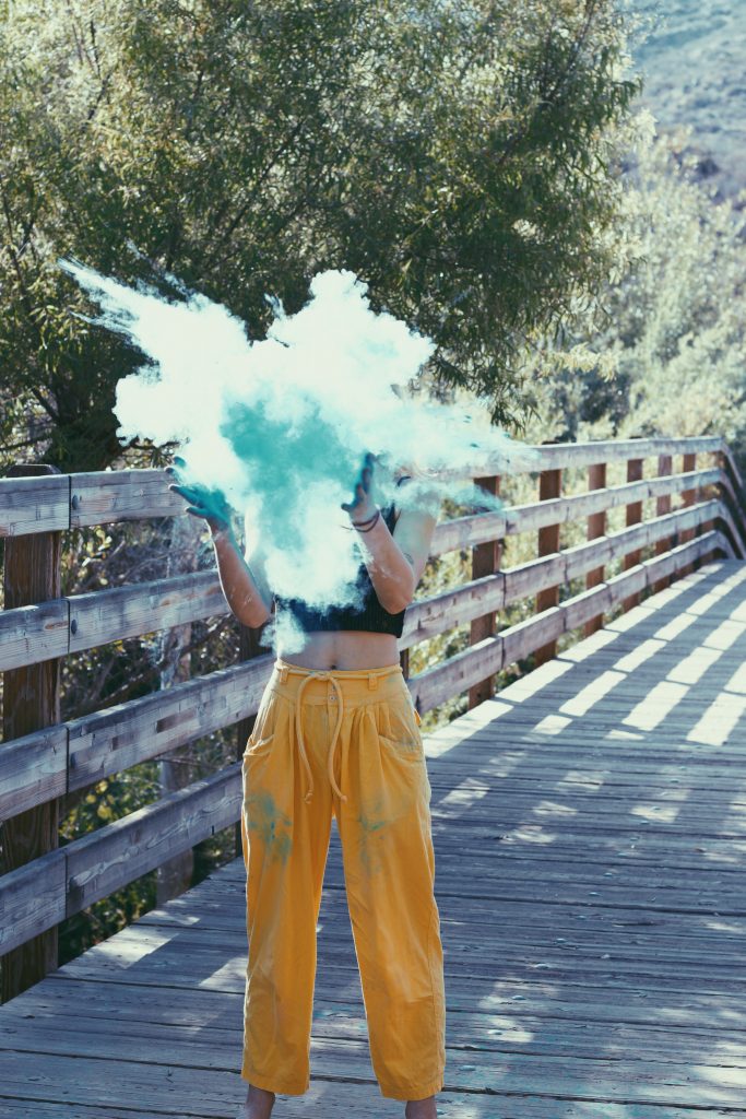Woman with blue smoke