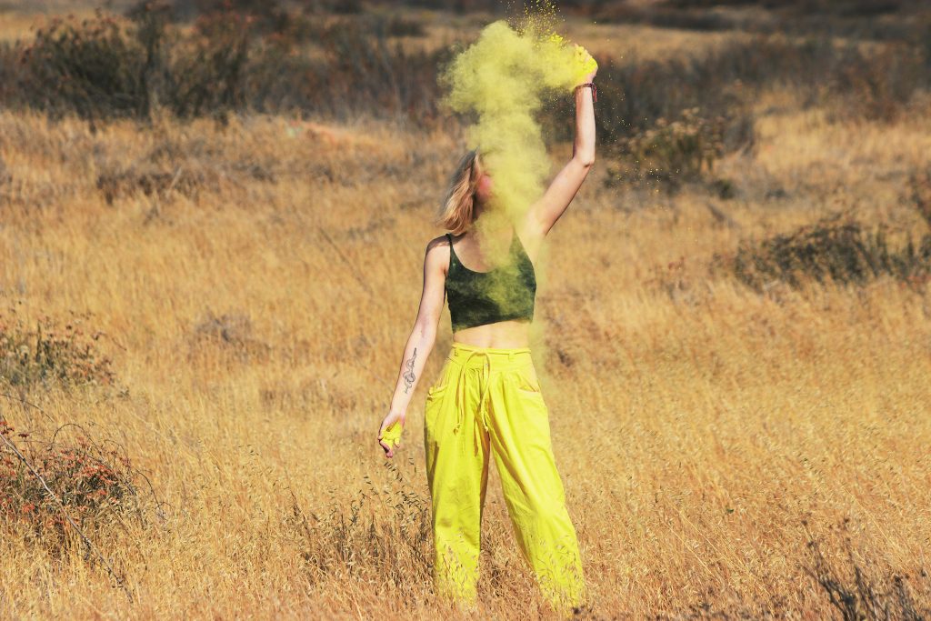Woman with yellow smoke